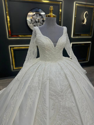 Luxurious Long Sleeve Wedding Dress with Plunging V-Neckline and Beaded Lace Appliques