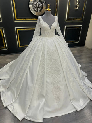 Luxurious Long Sleeve Wedding Dress with Plunging V-Neckline and Beaded Lace Appliques