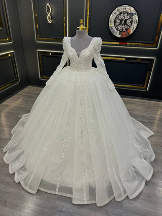 Opulent Long Sleeve Wedding Dress with Deep V-Neckline and Glittering Beaded Appliques