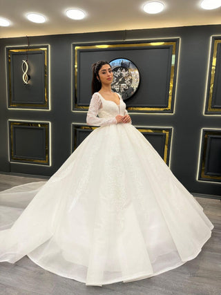 Luxurious Wedding Dress with Plunging Sweetheart Neckline and Beaded Sheer Long Sleeves