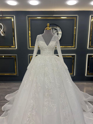 Majestic Long-Sleeve Beaded Ball Gown Wedding Dress with V-Neck and Intricate Appliques