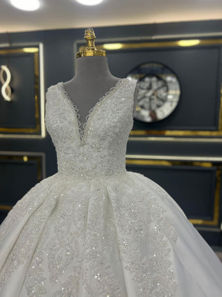 Luxurious V-Neck Beaded Ball Gown Wedding Dress with Intricate Appliques