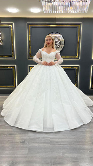 Exquisite Off-the-Shoulder Ball Gown Wedding Dress with Sheer Long Sleeves and Beaded Bodice