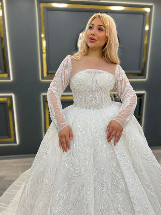 Luxurious Sheer Long Sleeve Ball Gown Wedding Dress with Beaded Bodice