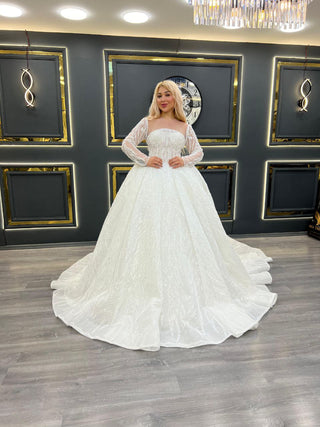 Luxurious Sheer Long Sleeve Ball Gown Wedding Dress with Beaded Bodice