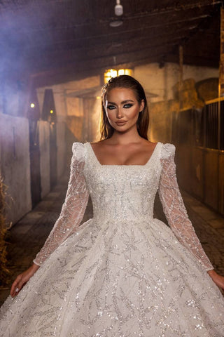 Majestic Sparkling Ball Gown Wedding Dress with Intricate Beaded Lace and Sheer Sleeves