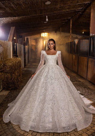 Majestic Sparkling Ball Gown Wedding Dress with Intricate Beaded Lace and Sheer Sleeves