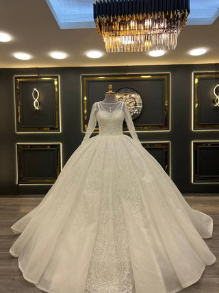 Ethereal Ball Gown Wedding Dress with Intricate Beaded Embellishments and Sheer Sleeves