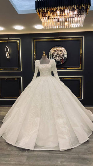 Regal Beaded Ball Gown Wedding Dress with Square Neckline and Elegant Long Sleeves