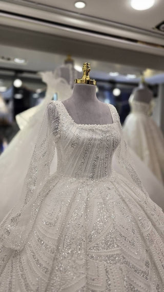 Elegant Crystal Embellished Bridal Ball Gown with Luxurious Train