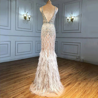 Elegant Nude Pink Mermaid Evening Dress - High Split, Luxury Feathers, and Beaded Details for Women's Party 2024