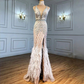 Elegant Nude Pink Mermaid Evening Dress - High Split, Luxury Feathers, and Beaded Details for Women's Party 2024