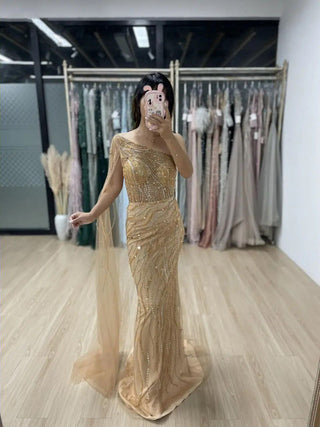 Gold One-Shoulder Beaded Mermaid Gown with Cape – Exclusive Dubai-Inspired Formal Dress for Prom & Special Occasions 2024