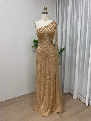 Gold One-Shoulder Beaded Mermaid Gown with Cape – Exclusive Dubai-Inspired Formal Dress for Prom & Special Occasions 2024