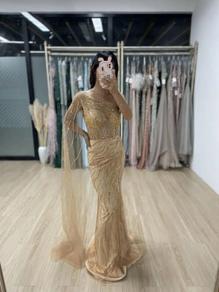 Gold One-Shoulder Beaded Mermaid Gown with Cape – Exclusive Dubai-Inspired Formal Dress for Prom & Special Occasions 2024