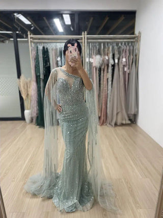 Ships in 1 to 3 Days - 2024 Green One-Shoulder Mermaid Evening Gown - Elegant Beaded Dress with Cape Sleeves for Women’s Wedding Guests and Parties