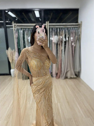 Gold One-Shoulder Beaded Mermaid Gown with Cape – Exclusive Dubai-Inspired Formal Dress for Prom & Special Occasions 2024