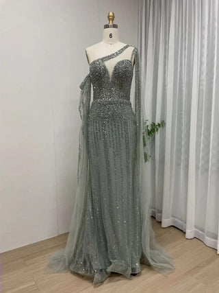 Ships in 1 to 3 Days - 2024 Green One-Shoulder Mermaid Evening Gown - Elegant Beaded Dress with Cape Sleeves for Women’s Wedding Guests and Parties