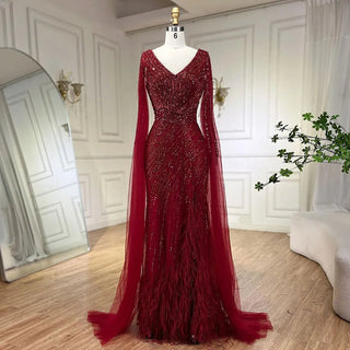 Midnight Majesty: 2024 Black Mermaid Evening Gown with Cape Sleeves and High Split - Luxury Beaded Feathers Dress for Women's Party