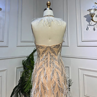 Desert Grace: Nude Mermaid Gown with Luxurious Feathers and Beads – Dubai 2024 Wedding Party Sensation