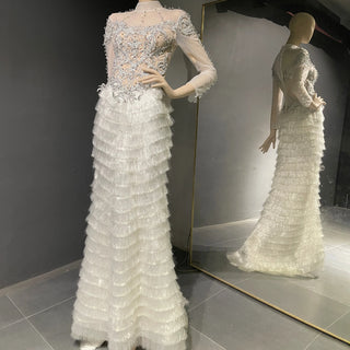 QUEENS DUBAI: Ethereal Elegance - Costume Dress with High Collar Neck, Sheer Illusion Design, Long Sleeves, Tassel Tiered Skirt, and Rhinestone Embellishments for a Mesmerizing Fashion Show Ensemble