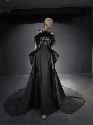 QUEENS DUBAI: Enchanting Elegance - Black Halter Costume Dress with Ostrich Feather Accents for a Fashion Show Evening