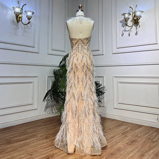 Desert Grace: Nude Mermaid Gown with Luxurious Feathers and Beads – Dubai 2024 Wedding Party Sensation