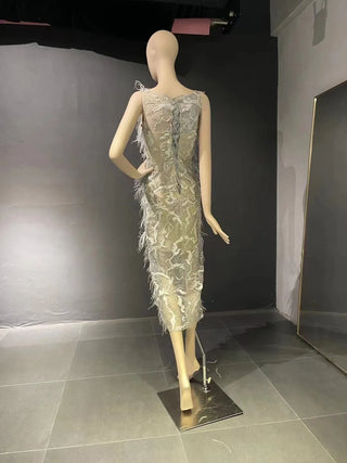 QUEENS DUBAI: Feathery Finesse - Mermaid Ostrich Feather Boat Neck Sleeveless Costume Dress with Detachable Train for a Mesmerizing Fashion Show Ensemble