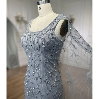 Gray Elegance: 2024 Mermaid Evening Gown with Cape Sleeves, Luxury Beading, and Arabic Inspiration